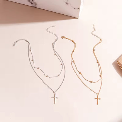 Colar Duplo com Pingente de Cruz – Dourado e Prateado